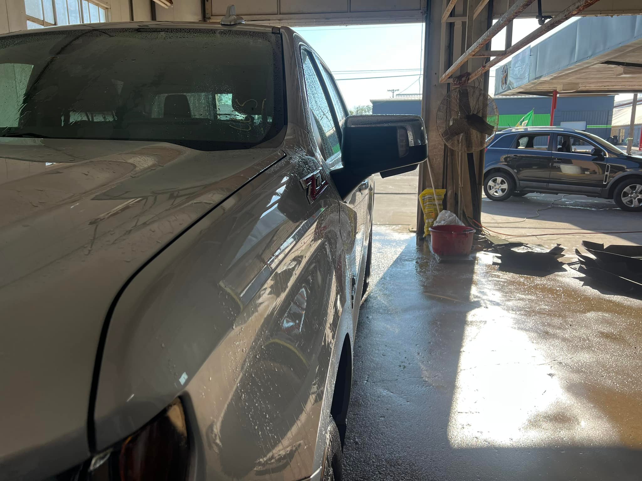 Truck getting hand washed with soap in the Texas Car Detail wash bay in Dublin, TX