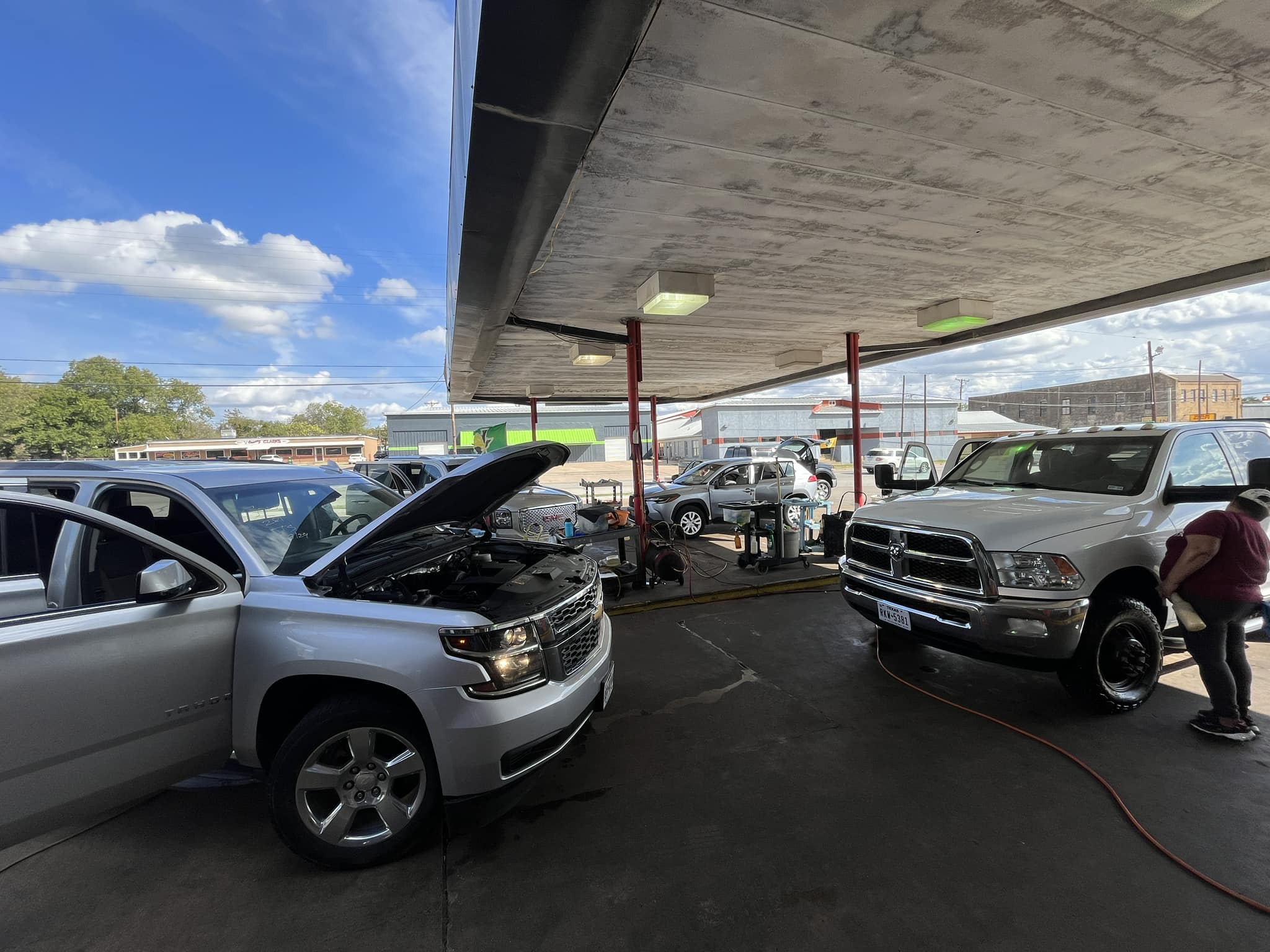 Vehicles being hand washed and detailed under the canopy at Texas Car Detail in Dublin, TX