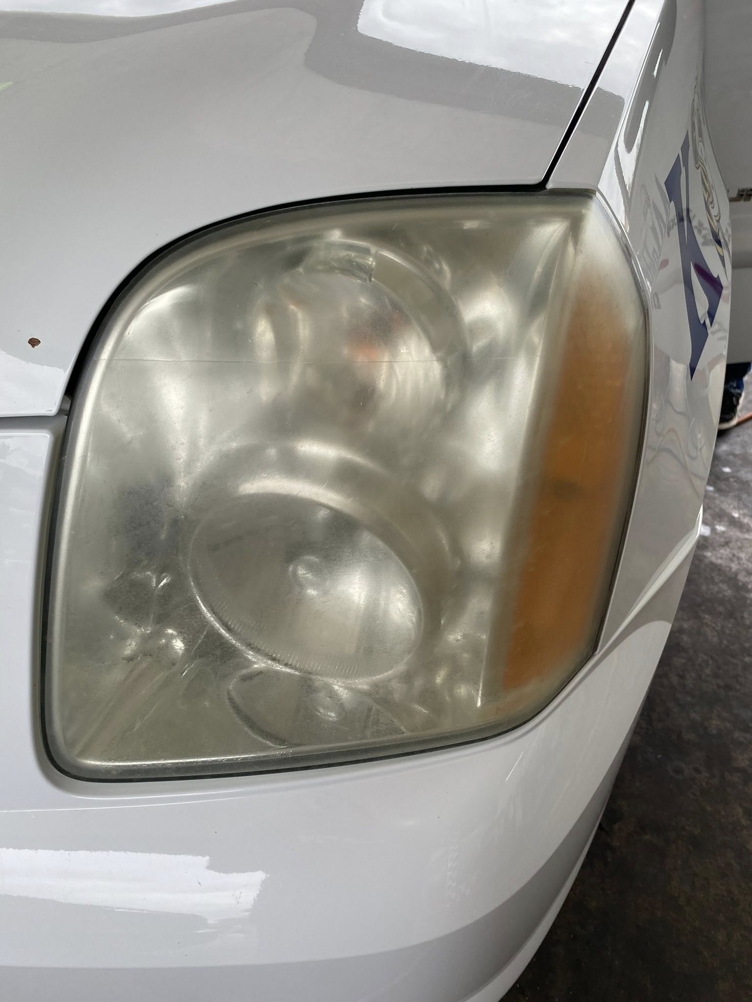 Cloudy, oxidized headlight lens before restoration in Dublin, TX