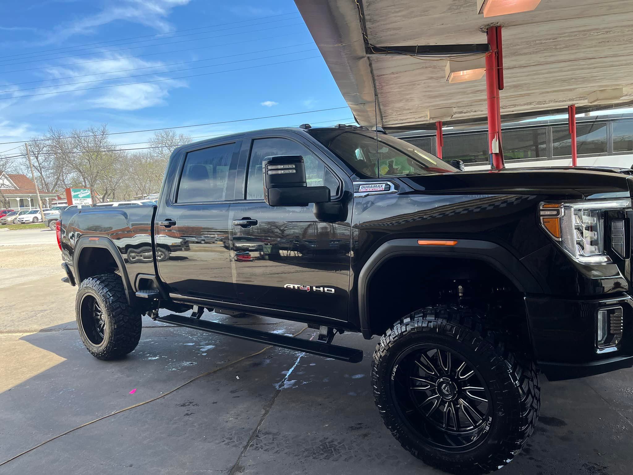 Black lifted pickup truck with a glossy hand-washed finish in Dublin, TX